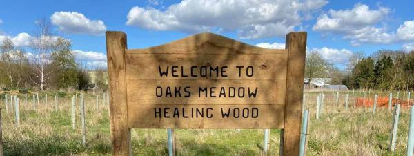 Oaks Meadow Healing Wood welcome sign